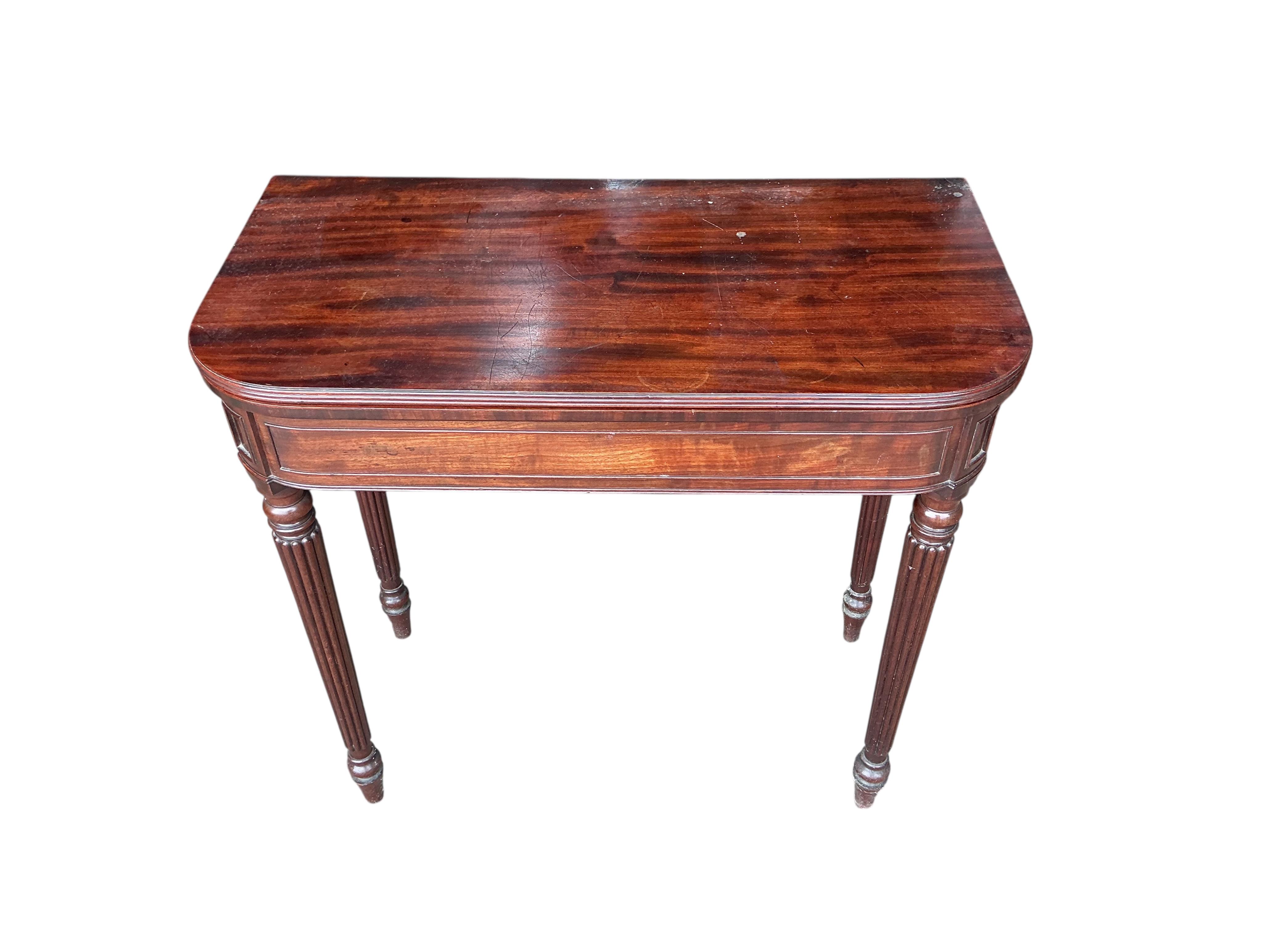 A Regency mahogany D-shaped folding tea table, width 76cm, depth 38cm, height 74cm